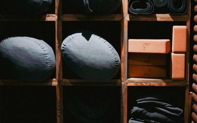 Yoga blocks and strap arranged neatly on the floor